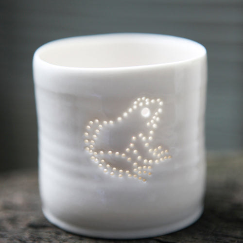 Cute little frog design. Porcelain candle holder with a sitting frog outline in pierced holes. Ceramic tealight holder. Wildlife. Outdoorsy present.